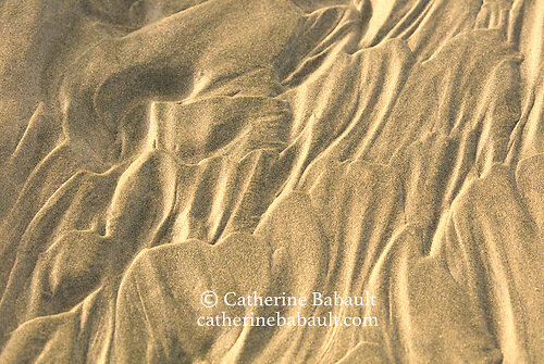 Sand sculpted by receding tide